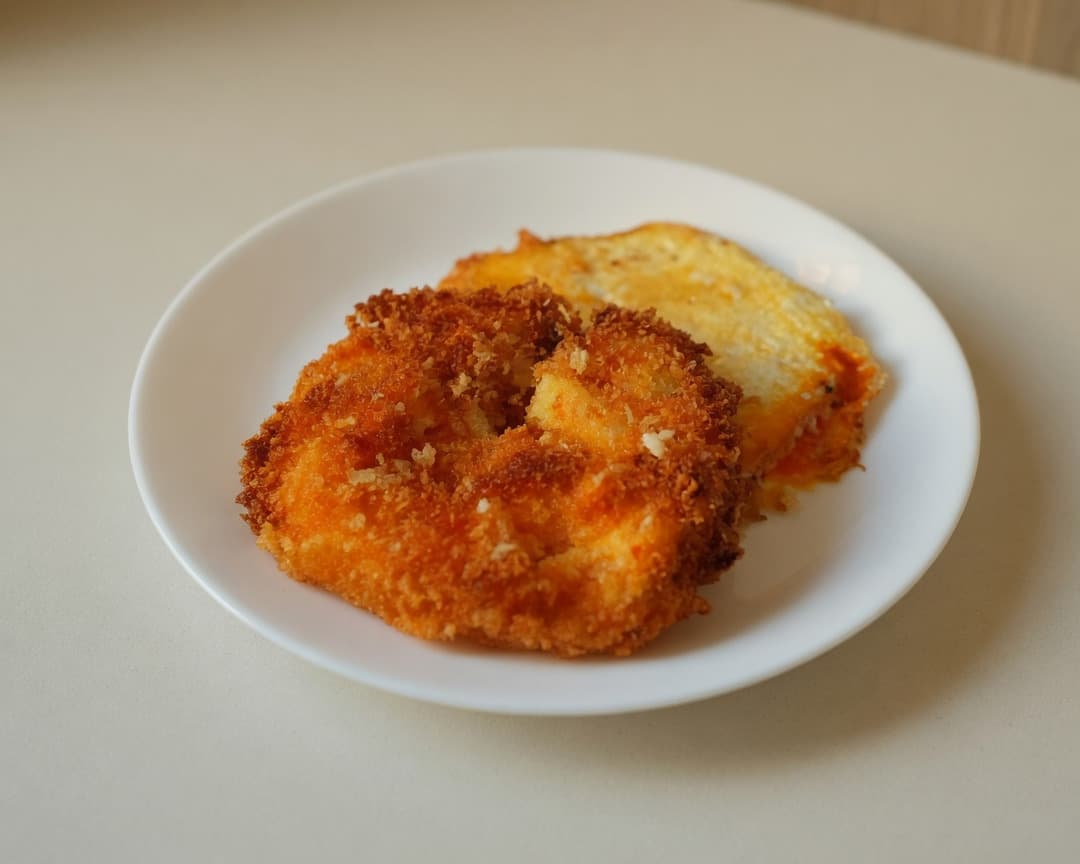 Crispy breadcrumb egg katsu split open with melted Perfect Italiano Mozzarella